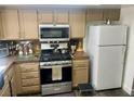 Functional kitchen with appliances, plenty of storage, and a step stool for convenience at 6429 Rosemount Ave, Las Vegas, NV 89156