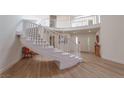 Bright foyer with a grand, curved staircase and an open layout at 7625 Spanish Bay Dr, Las Vegas, NV 89113