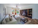 Comfortable living room with built-in shelves and a view of the backyard and pool at 7625 Spanish Bay Dr, Las Vegas, NV 89113