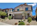 Stunning home with a two-car garage, desert landscaping, and a welcoming entryway at 8898 Sasquatch Run Ave, Las Vegas, NV 89166