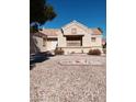 Charming single-story home featuring a two-car garage and a well-maintained gravel yard at 9312 Yucca Blossom Dr, Las Vegas, NV 89134