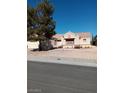 Charming single-story home featuring a two-car garage and a well-maintained gravel yard at 9312 Yucca Blossom Dr, Las Vegas, NV 89134