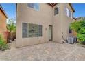 Private backyard featuring a brick patio and mature landscaping, perfect for outdoor entertaining at 10410 Poplar Park Ave, Las Vegas, NV 89166