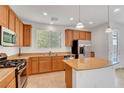 Spacious kitchen with stainless steel appliances, a center island, and plenty of cabinet space at 10410 Poplar Park Ave, Las Vegas, NV 89166