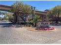 View of the Village of Avellino community entrance with gate and beautiful landscaping at 1139 Via Partito, Henderson, NV 89052