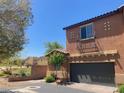 Two-story home with a private garage and an ornamental balcony overlooking the neighborhood at 1139 Via Partito, Henderson, NV 89052