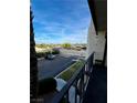 View from the condo balcony featuring a landscaped parking lot and street at 1440 Vegas Valley Dr # 2, Las Vegas, NV 89169