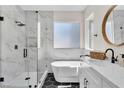 Bathroom featuring a soaking tub, a walk-in shower, and marble countertops at 1551 Boundary Peak Way, Las Vegas, NV 89135