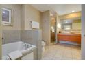 Spa-like bathroom featuring a soaking tub, walk-in shower, and sleek vanity at 211 E Flamingo Rd # 620, Las Vegas, NV 89169