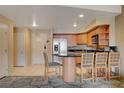 Compact kitchen features bar seating, modern appliances, and ample counter space at 211 E Flamingo Rd # 620, Las Vegas, NV 89169