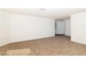 Inviting living room with neutral carpet, white walls, and natural light at 2191 Bay Club Dr # 204, Laughlin, NV 89029