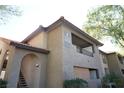 Apartment building with covered balcony and red tile roofing at 2606 S Durango Dr # 264, Las Vegas, NV 89117