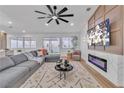 Comfortable living room boasts a large sectional, fireplace, and backyard access at 3109 Siena Cir, Las Vegas, NV 89128