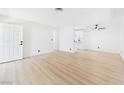 Bright living room featuring new vinyl floors and fresh paint at 3654 Villa Knolls South Dr, Las Vegas, NV 89120