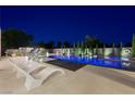 Beautiful pool and backyard, perfect for outdoor entertaining and relaxation with modern lounge furniture at 3740 Caesars Cir, Las Vegas, NV 89120