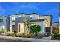 Stylish two-story residence displays a clean facade with an attached garage and fresh landscaping at 4177 Railhead Pass Ave, Las Vegas, NV 89141