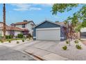 Charming single-story home featuring a two-car garage and low-maintenance desert landscaping at 4205 Caliper Dr, Las Vegas, NV 89110