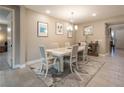 Bright dining room with modern light fixture and tile flooring at 4289 Sunrise Flats St, Las Vegas, NV 89135