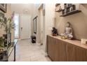 Elegant foyer featuring tile flooring, a decorative cabinet, and a bright entrance at 4289 Sunrise Flats St, Las Vegas, NV 89135