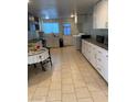 Bright kitchen with white cabinets and ample counter space at 4626 Sacks Dr, Las Vegas, NV 89122