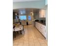 Spacious kitchen with white cabinets and tile flooring at 4626 Sacks Dr, Las Vegas, NV 89122
