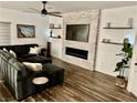 Comfortable living room with a decorative fireplace and a large TV creating a welcoming ambiance at 600 N Carriage Hill Dr # 1082, Las Vegas, NV 89138