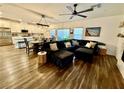 Spacious living room showcasing an open floor plan connecting to the kitchen and stylish hardwood floors at 600 N Carriage Hill Dr # 1082, Las Vegas, NV 89138