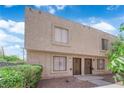 Two story townhome showcasing a modern design and low-maintenance landscaping at 6299 W Washington Ave, Las Vegas, NV 89107
