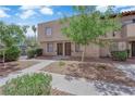 Charming exterior view with well-kept landscaping and a sidewalk that leads to the entrance at 6299 W Washington Ave, Las Vegas, NV 89107