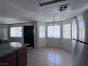 Bright dining area features tiled floors and plenty of natural light from the many windows at 805 Rock Springs Dr # 101, Las Vegas, NV 89128