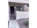 Private patio with a metal gate, leading to front door at 805 Rock Springs Dr # 101, Las Vegas, NV 89128