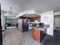 Bright kitchen featuring stainless steel appliances and a breakfast bar at 805 Rock Springs Dr # 101, Las Vegas, NV 89128