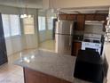 Kitchen featuring stainless steel appliances and breakfast bar at 805 Rock Springs Dr # 101, Las Vegas, NV 89128