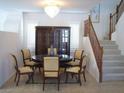 Formal dining area boasts hardwood staircase, large hutch, with elegant decor and a chandelier at 8139 Retriever Ave, Las Vegas, NV 89147