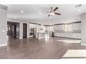 Spacious kitchen and living area boasts stainless steel appliances and a large island at 8797 Pinley Spring St, Las Vegas, NV 89113