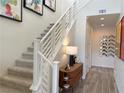 Elegant staircase with white railings and modern decor at 929 Hunter Shores Ave, North Las Vegas, NV 89084