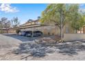 Assigned covered parking space with mature landscaping and shade trees at , Henderson, NV 89011