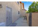 Enclosed patio features secure gate, seating, and direct access to parking at , Henderson, NV 89011