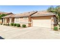 Single-story home showing attached garage, well maintained landscaping, and appealing architectural details at 1440 Summer Glow Ave, Henderson, NV 89012