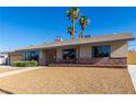 Charming single story home featuring well-maintained landscaping, attractive desert rock, and unique security door at 1727 Cherokee Ln, Las Vegas, NV 89169