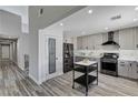 Well-lit kitchen with sleek appliances, subway tile backsplash, and a convenient pantry at 1940 Canterbury Dr, Las Vegas, NV 89119