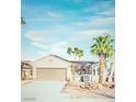 Charming single-story home featuring desert landscaping and a two-car garage at 2078 Wildwood Lake St, Henderson, NV 89052