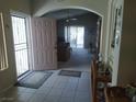 Inviting foyer with tile flooring leads into a bright living space, offering a welcoming entrance at 2148 Hidden Ranch Ter, Henderson, NV 89052