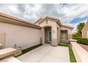 Welcoming home entrance with textured walls, covered walkway, and desert landscaping accents at 2164 Eagle Sticks Dr, Henderson, NV 89012