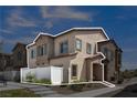Corner townhome showcasing stucco exterior, private yard, and attached garage, offering modern living at 236 Callen Falls Ave # 1211, Henderson, NV 89011