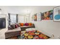 Bright living room with contemporary decor, plush sofa, and natural light at 2460 Old Forge Ln # 48, Las Vegas, NV 89121