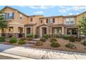 Attractive townhome with well-kept landscaping and charming stone accents at 2871 Tanager Hill St, Henderson, NV 89044