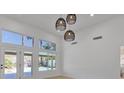 Bright living room with a view of the backyard pool at 2894 Matese Dr, Henderson, NV 89052