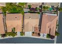 Aerial view of a home with a well-maintained roof, backyard landscaping and neighborhood at 3278 Turning Bridge St, Las Vegas, NV 89135