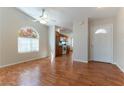 Bright living room with hardwood floors and arch windows that let in natural light at 3510 Judah Way, Las Vegas, NV 89147